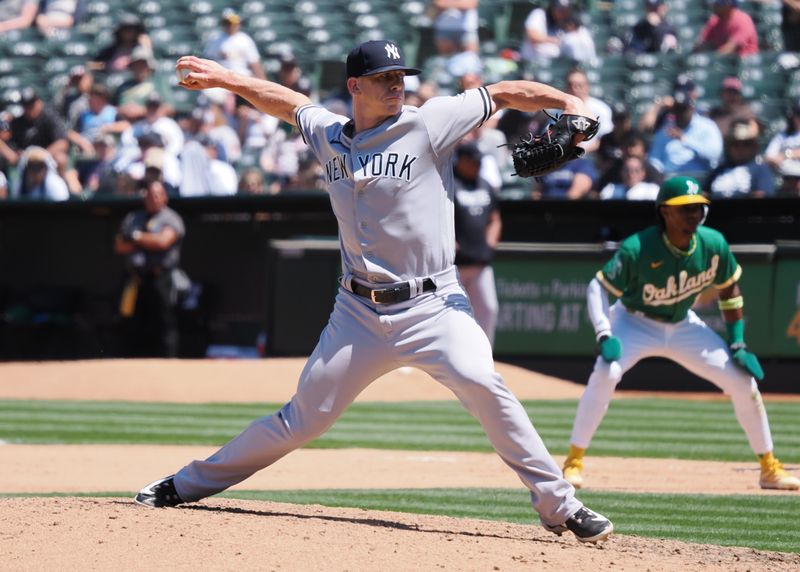 Jun 29, 2023; Oakland, California, USA; New York Yankees relief pitcher Ian Hamilton (71) pitches the ball against the Oakland Athletics during the sixth inning at Oakland-Alameda County Coliseum. Mandatory Credit: Kelley L Cox-USA TODAY Sports