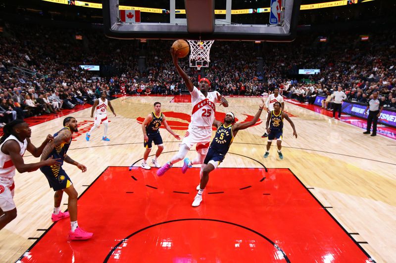 TORONTO, CANADA - NOVEMBER 18: Chris Boucher #25 of the Toronto Raptors drives to the basket during the game against the Indiana Pacers on November 18, 2024 at the Scotiabank Arena in Toronto, Ontario, Canada.  NOTE TO USER: User expressly acknowledges and agrees that, by downloading and or using this Photograph, user is consenting to the terms and conditions of the Getty Images License Agreement.  Mandatory Copyright Notice: Copyright 2024 NBAE (Photo by Vaughn Ridley/NBAE via Getty Images)