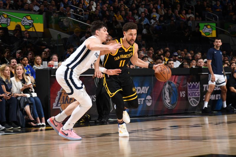 SAN FRANCISCO, CA - MARCH 20: Klay Thompson #11 of the Golden State Warriors dribbles the ball during the game against the Memphis Grizzlies on March 20, 2024 at Chase Center in San Francisco, California. NOTE TO USER: User expressly acknowledges and agrees that, by downloading and or using this photograph, user is consenting to the terms and conditions of Getty Images License Agreement. Mandatory Copyright Notice: Copyright 2024 NBAE (Photo by Noah Graham/NBAE via Getty Images)