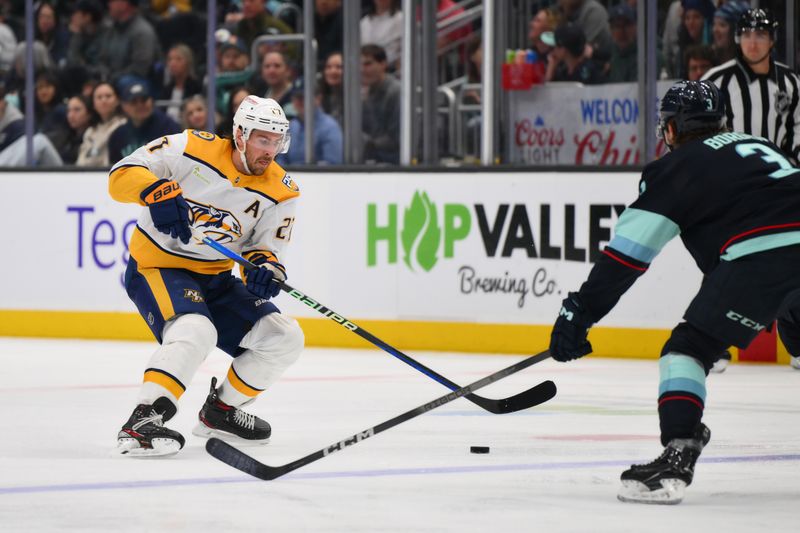 Mar 16, 2024; Seattle, Washington, USA; Nashville Predators center Mark Jankowski (17) plays the puck during the third period against the Seattle Kraken at Climate Pledge Arena. Mandatory Credit: Steven Bisig-USA TODAY Sports