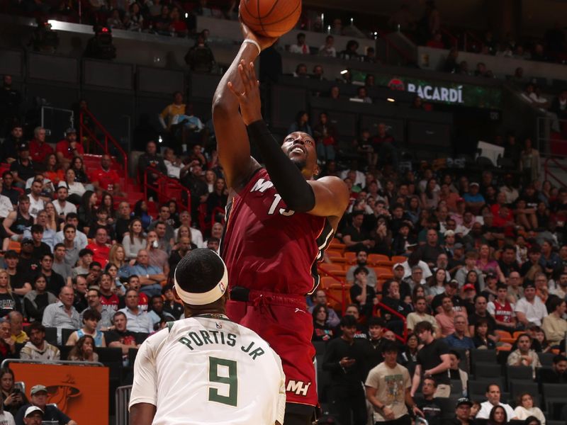 MIAMI, FL - NOVEMBER 26: Bam Adebayo #13 of the Miami Heat shoots the ball during the game against the Milwaukee Bucks during the Emirates NBA Cup game on November 26, 2024 at Kaseya Center in Miami, Florida. NOTE TO USER: User expressly acknowledges and agrees that, by downloading and or using this Photograph, user is consenting to the terms and conditions of the Getty Images License Agreement. Mandatory Copyright Notice: Copyright 2024 NBAE (Photo by Issac Baldizon/NBAE via Getty Images)