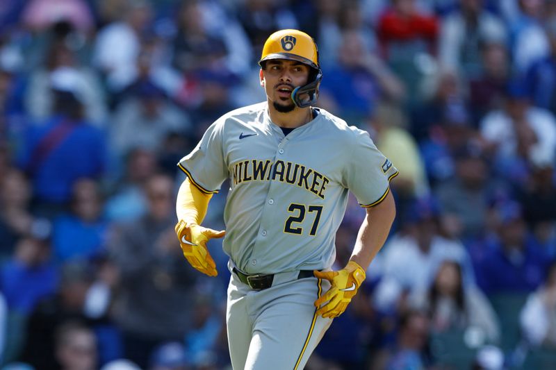 May 3, 2024; Chicago, Illinois, USA; Milwaukee Brewers shortstop Willy Adames (27) reacts after scoring against the Chicago Cubs during the eight inning at Wrigley Field. Mandatory Credit: Kamil Krzaczynski-USA TODAY Sports