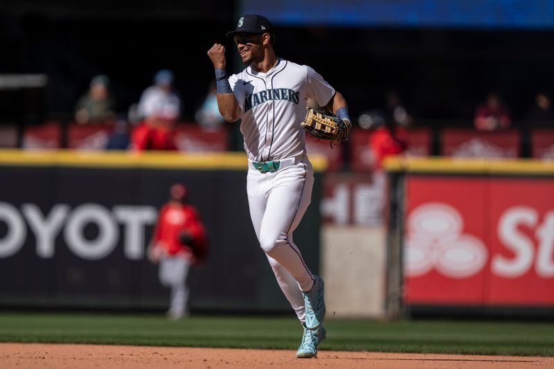 Apr 17, 2024; Seattle, Washington, USA; Seattle Mariners centerfielder Julio Rodriguez (44) celebrates ater a game against the Cincinnati Reds at T-Mobile Park. Mandatory Credit: Stephen Brashear-USA TODAY Sports