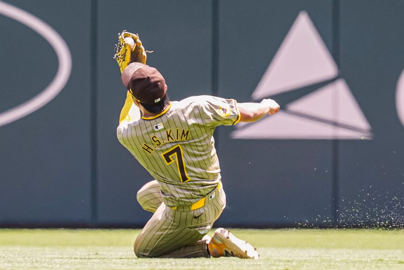 May 20, 2024; Cumberland, Georgia, USA; San Diego Padres shortstop Ha-Seong Kim (7) makes a diving catch on a ball hit by Atlanta Braves center fielder Michael Harris II (23) (not shown) during the ninth inning at Truist Park. Mandatory Credit: Dale Zanine-USA TODAY Sports