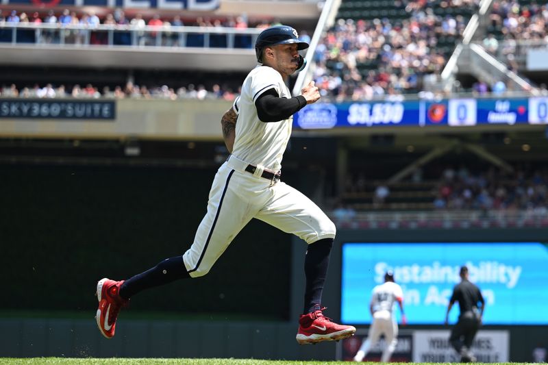 Jul 9, 2023; Minneapolis, Minnesota, USA; Minnesota Twins shortstop Carlos Correa (4) scores on a double by second baseman Edouard Julien (not pictured) during the first inning against the Baltimore Orioles at Target Field. Mandatory Credit: Jeffrey Becker-USA TODAY Sports