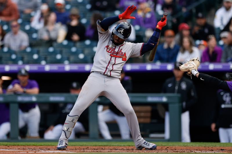 Apr 28, 2025; Denver, Colorado, USA; Atlanta Braves second baseman Ozzie Albies (1) leans away from a pitch in the second inning against the Colorado Rockies at Coors Field. Mandatory Credit: Isaiah J. Downing-Imagn Images