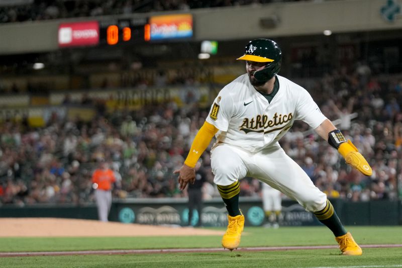 Sep 24, 2025; West Sacramento, California, USA; Athletics catcher Shea Langeliers (23) looks towards the outfield after rounding third base against the Houston Astros in the third inning at Sutter Health Park. Mandatory Credit: Cary Edmondson-Imagn Images