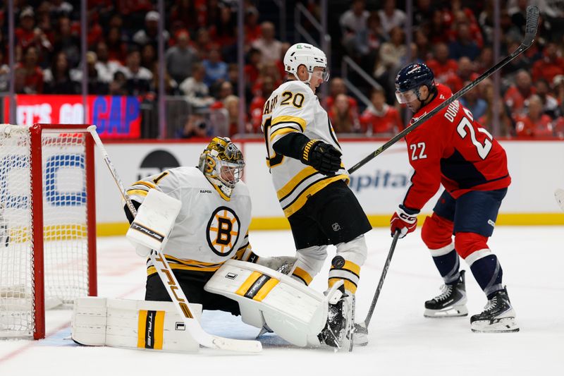 Oct 8, 2025; Washington, District of Columbia, USA; Boston Bruins goaltender Jeremy Swayman (1) makes a save against against the Washington Capitals during the third period at Capital One Arena. Mandatory Credit: Geoff Burke-Imagn Images