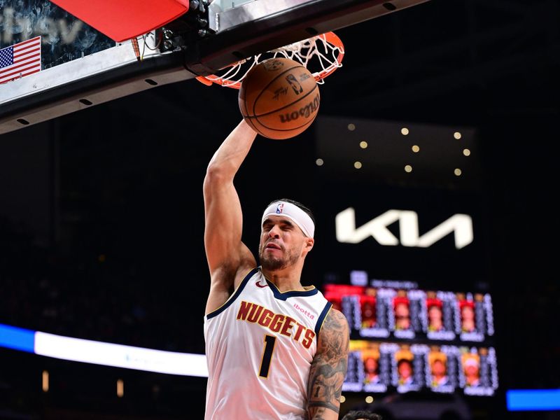 ATLANTA, GA - DECEMBER 8: Michael Porter Jr. #1 of the Denver Nuggets dunks the ball during the game against the Atlanta Hawks on December 8, 2024 at State Farm Arena in Atlanta, Georgia.  NOTE TO USER: User expressly acknowledges and agrees that, by downloading and/or using this Photograph, user is consenting to the terms and conditions of the Getty Images License Agreement. Mandatory Copyright Notice: Copyright 2024 NBAE (Photo by Adam Hagy/NBAE via Getty Images)