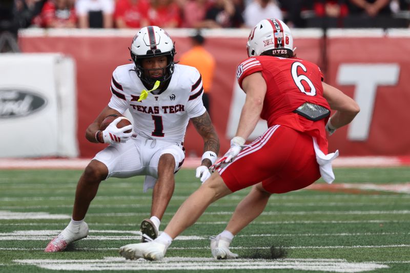 Sep 20, 2025; Salt Lake City, Utah, USA; Texas Tech Red Raiders wide receiver Reggie Virgil (1) runs after a catch against Utah Utes safety Nate Ritchie (6) during the third quarter at Rice-Eccles Stadium. Mandatory Credit: Rob Gray-Imagn Images