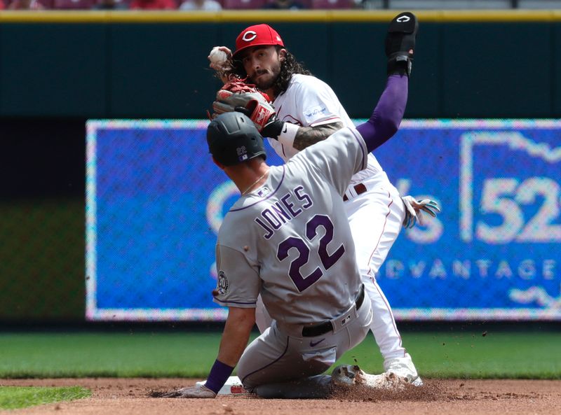 Jun 21, 2023; Cincinnati, Ohio, USA; Colorado Rockies first baseman Nolan Jones (22) is forced out at second against Cincinnati Reds second baseman Jonathan India (6) during the first inning at Great American Ball Park. Mandatory Credit: David Kohl-USA TODAY Sports