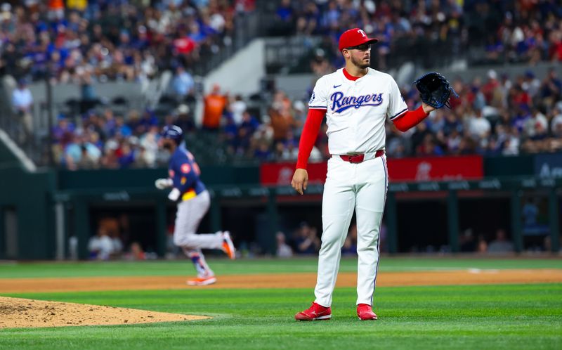 Aug 6, 2024; Arlington, Texas, USA; Texas Rangers starting pitcher Dane Dunning (33) reacts after giving up a home run to Houston Astros left fielder Yordan Alvarez (back) during the ninth inning at Globe Life Field. Mandatory Credit: Kevin Jairaj-USA TODAY Sports