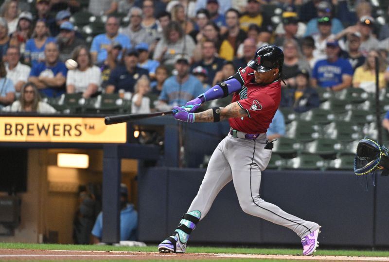 Sep 20, 2024; Milwaukee, Wisconsin, USA; Arizona Diamondbacks second base Ketel Marte (4) hits a home run against the Milwaukee Brewers in the first inning at American Family Field. Mandatory Credit: Michael McLoone-Imagn Images