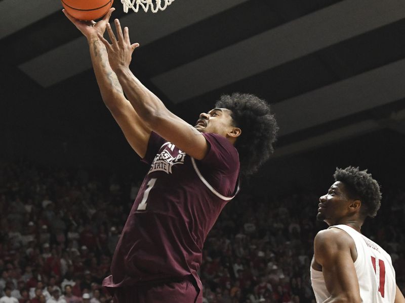 Feb 3, 2024; Tuscaloosa, Alabama, USA;  Mississippi State forward Tolu Smith III (1) scores inside against Alabama forward Mohamed Wague (11) at Coleman Coliseum. Mandatory Credit: Gary Cosby Jr.-USA TODAY Sports