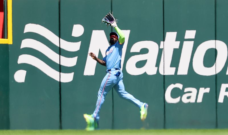 May 4, 2025; Arlington, Texas, USA;  Texas Rangers right fielder Adolis Garcia (53) makes a catch during the fifth inning against the Seattle Mariners at Globe Life Field. Mandatory Credit: Kevin Jairaj-Imagn Images