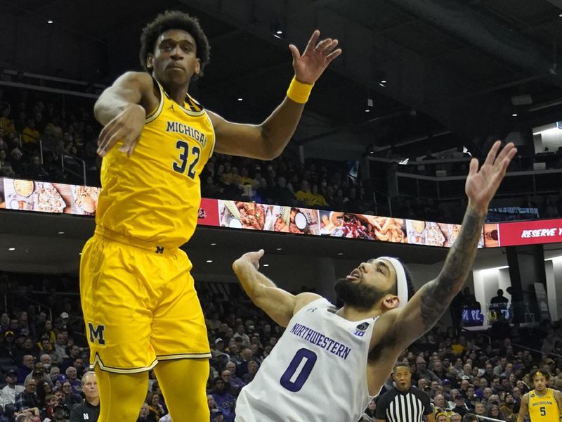 Feb 2, 2023; Evanston, Illinois, USA; Michigan Wolverines forward Tarris Reed Jr. (32) defends Northwestern Wildcats guard Boo Buie (0) during the second half at Welsh-Ryan Arena. Mandatory Credit: David Banks-USA TODAY Sports