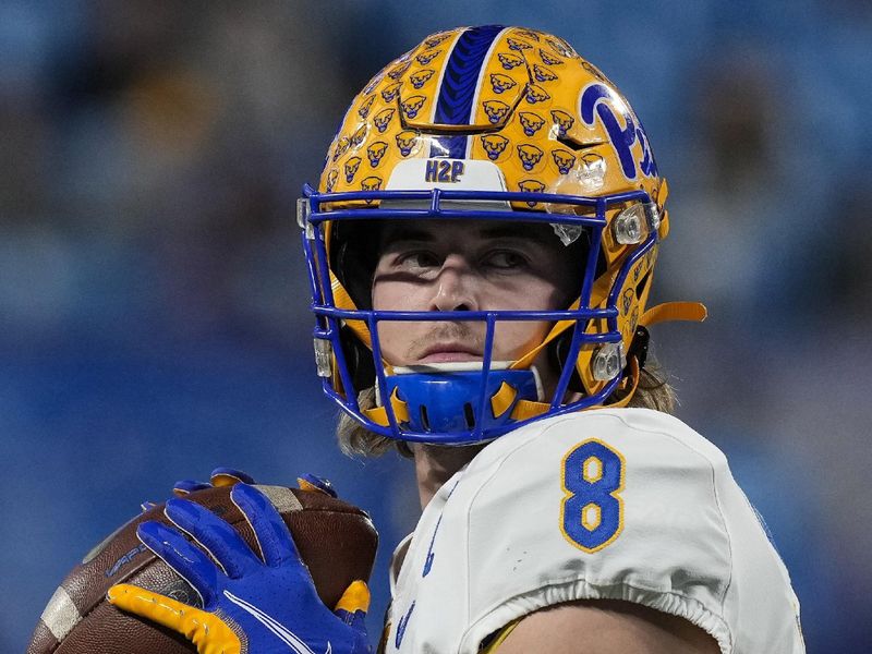 Dec 4, 2021; Charlotte, NC, USA; Pittsburgh Panthers quarterback Kenny Pickett (8) warms up before the ACC championship game against the Wake Forest Demon Deacons at Bank of America Stadium. Mandatory Credit: Jim Dedmon-USA TODAY Sports