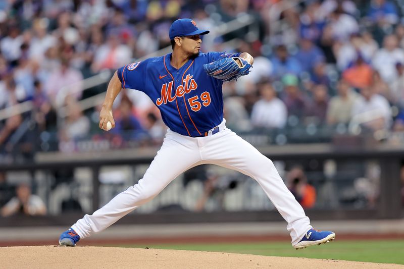 Aug 14, 2023; New York City, New York, USA; New York Mets starting pitcher Carlos Carrasco (59) pitches against the Pittsburgh Pirates during the first inning at Citi Field. Mandatory Credit: Brad Penner-USA TODAY Sports