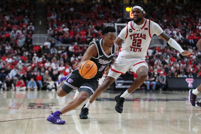 Jan 13, 2024; Lubbock, Texas, USA;  Kansas State Wildcats guard Tylor Perry (2) drives to the lane against Texas Tech Red Raiders forward Warren Washington (22) in the second half at United Supermarkets Arena. Mandatory Credit: Michael C. Johnson-USA TODAY Sports