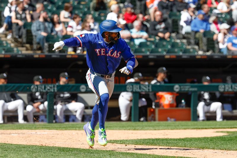 May 25, 2025; Chicago, Illinois, USA; Texas Rangers right fielder Adolis García (53) runs after hitting a two-run double against the Chicago White Sox during the ninth inning at Rate Field. Mandatory Credit: Kamil Krzaczynski-Imagn Images