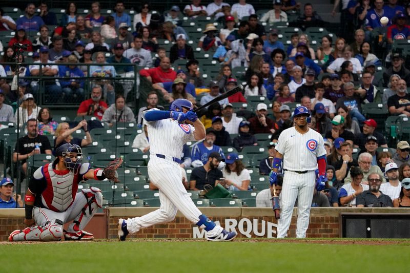 Sep 22, 2024; Chicago, Illinois, USA; Chicago Cubs first baseman Michael Busch (29) hits a home run against the Washington Nationals during the fourth inning at Wrigley Field. Mandatory Credit: David Banks-Imagn Images