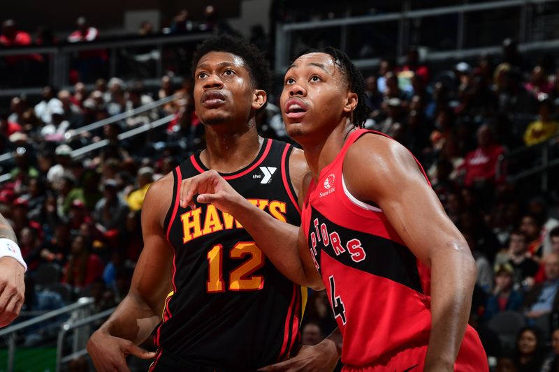 ATLANTA, GA - February 23:  Scottie Barnes #4 of the Toronto Raptors and De'Andre Hunter #12 of the Atlanta Hawks battle for position on February 23, 2024 at State Farm Arena in Atlanta, Georgia.  NOTE TO USER: User expressly acknowledges and agrees that, by downloading and/or using this Photograph, user is consenting to the terms and conditions of the Getty Images License Agreement. Mandatory Copyright Notice: Copyright 2024 NBAE (Photo by Scott Cunningham/NBAE via Getty Images)