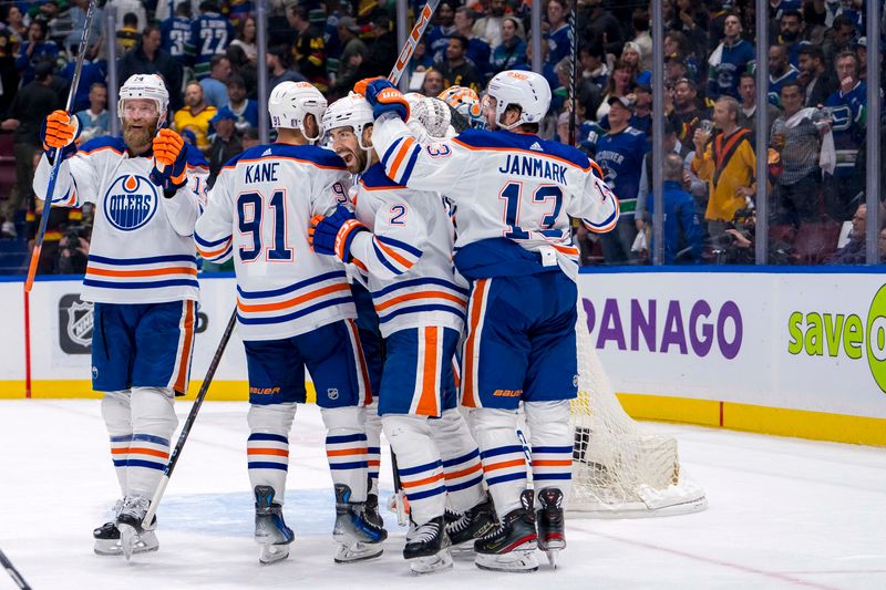 May 20, 2024; Vancouver, British Columbia, CAN; The Edmonton Oilers celebrate their victory over the Vancouver Canucks in game seven of the second round of the 2024 Stanley Cup Playoffs at Rogers Arena. Mandatory Credit: Bob Frid-USA TODAY Sports