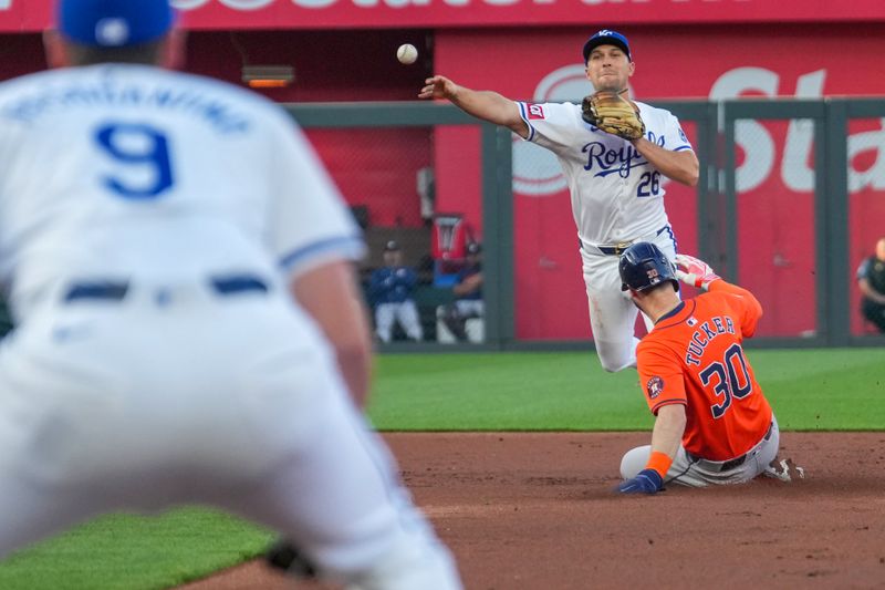 Apr 9, 2024; Kansas City, Missouri, USA; Kansas City Royals second base Adam Frazier (26) gets the force out on Houston Astros designated hitter Kyle Tucker (30) at second base and throws to first in the first inning at Kauffman Stadium. Mandatory Credit: Denny Medley-USA TODAY Sports