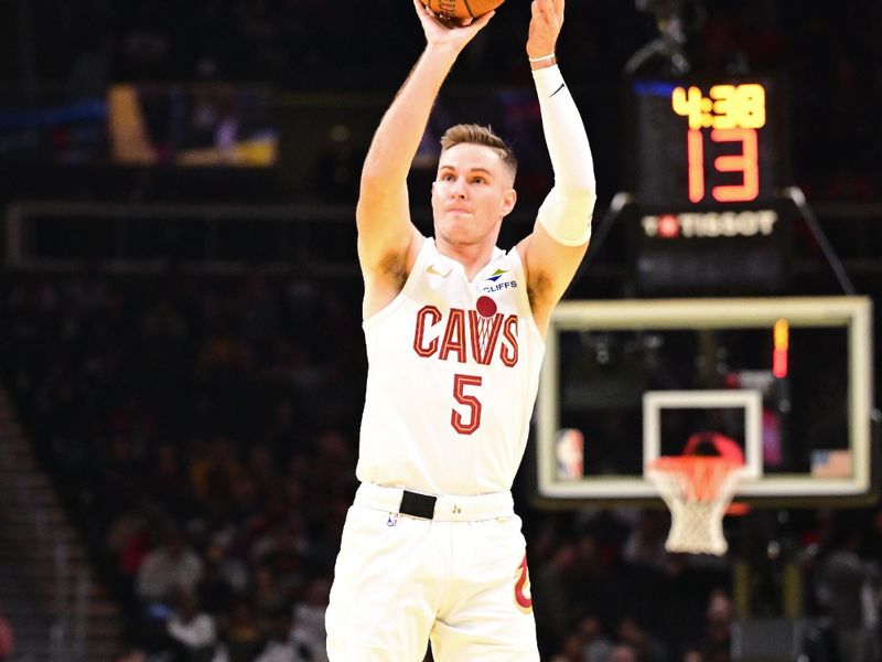 ATLANTA, GA - NOVEMBER 29: Sam Merrill #5 of the Cleveland Cavaliers three point basket during the game against the Atlanta Hawks on November 29, 2024 at State Farm Arena in Atlanta, Georgia.  NOTE TO USER: User expressly acknowledges and agrees that, by downloading and/or using this Photograph, user is consenting to the terms and conditions of the Getty Images License Agreement. Mandatory Copyright Notice: Copyright 2024 NBAE (Photo by Adam Hagy/NBAE via Getty Images)