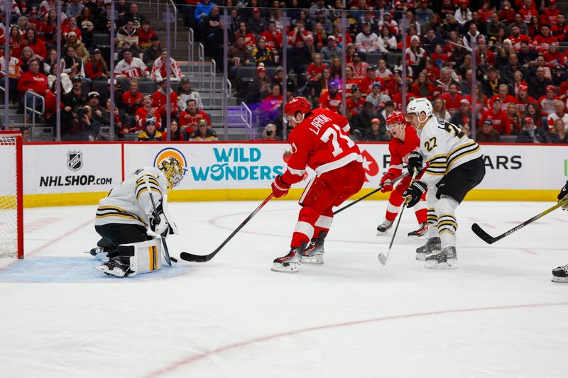 Dec 31, 2023; Detroit, Michigan, USA; Detroit Red Wings center Dylan Larkin (71) takes a shot on Boston Bruins goaltender Jeremy Swayman (1) during the second period of the game between the Boston Bruins and the Detroit Red Wings at Little Caesars Arena. Mandatory Credit: Brian Bradshaw Sevald-USA TODAY Sports