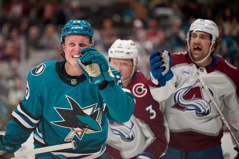 Oct 20, 2024; San Jose, California, USA; San Jose Sharks left wing Fabian Zetterlund (20) and Colorado Avalanche left wing Miles Wood (28) react during a stoppage of play in the second period at SAP Center at San Jose. Mandatory Credit: Robert Edwards-Imagn Images