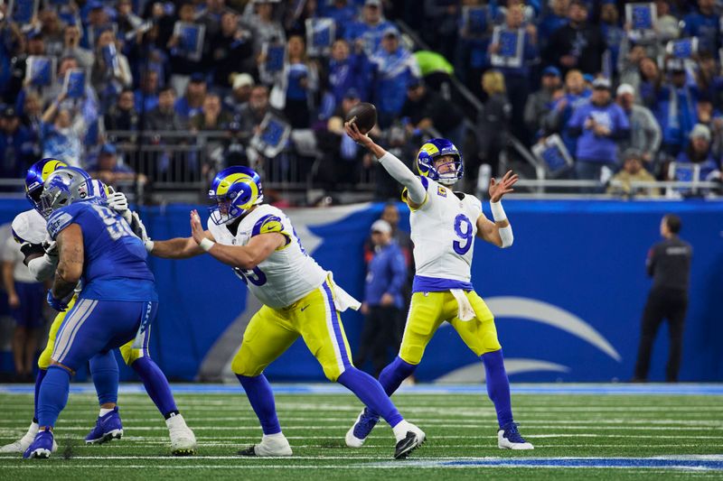 Los Angeles Rams quarterback Matthew Stafford (9) passes against the Detroit Lions during an NFL wild-card playoff football game, Saturday, Jan. 14, 2024, in Detroit. (AP Photo/Rick Osentoski)