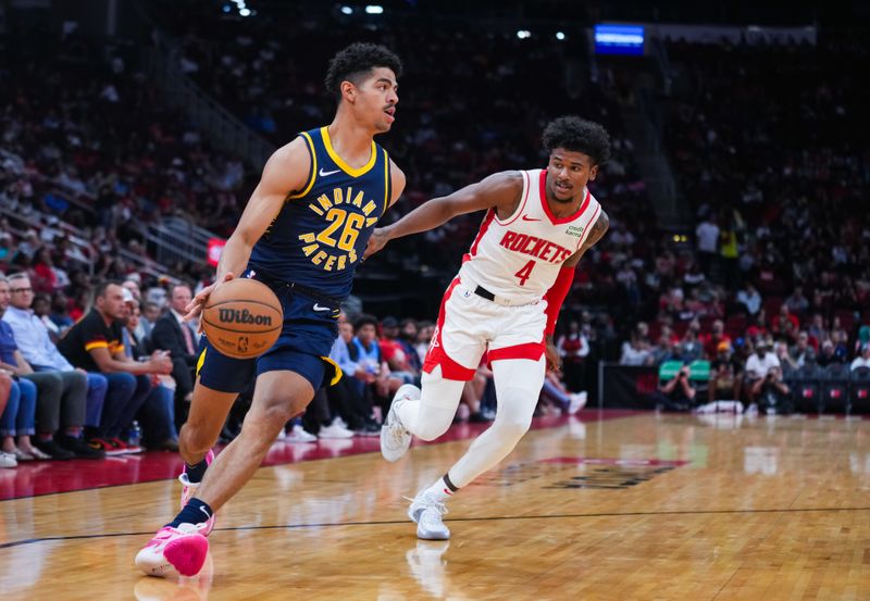 HOUSTON, TEXAS - OCTOBER 10: Ben Sheppard #26 of the Indiana Pacers dribbles the ball as Jalen Green #4 of the Houston Rockets defends during the first quarter of the preseason game at Toyota Center on October 10, 2023 in Houston, Texas. NOTE TO USER: User expressly acknowledges and agrees that, by downloading and or using this photograph, User is consenting to the terms and conditions of the Getty Images License Agreement. (Photo by Alex Bierens de Haan/Getty Images)