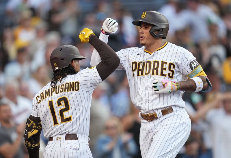 Jul 25, 2023; San Diego, California, USA; San Diego Padres third baseman Manny Machado (13) celebrates his home run with designated hitter Luis Campusano (12) during the second inning against the Pittsburgh Pirates at Petco Park. Mandatory Credit: Ray Acevedo-USA TODAY Sports