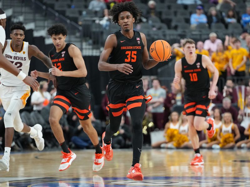 Mar 8, 2023; Las Vegas, NV, USA; Oregon State Beavers forward Glenn Taylor Jr. (35) dribbles against the Arizona State Sun Devils during the second half at T-Mobile Arena. Mandatory Credit: Stephen R. Sylvanie-USA TODAY Sports