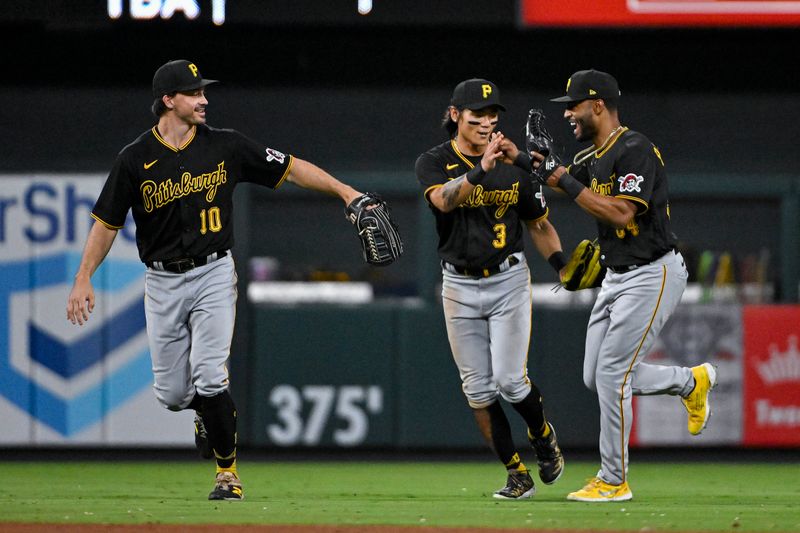 Sep 1, 2023; St. Louis, Missouri, USA;  Pittsburgh Pirates left fielder Bryan Reynolds (10) celebrates with center fielder Ji Hwan Bae (3) and right fielder Joshua Palacios (54) after the Pirates defeated the St. Louis Cardinals in ten innings at Busch Stadium. Mandatory Credit: Jeff Curry-USA TODAY Sports