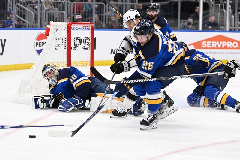 Jan 28, 2024; St. Louis, Missouri, USA; St. Louis Blues left wing Nathan Walker (26) battles Los Angeles Kings left wing Trevor Moore (12) for the puck during the third period at Enterprise Center. Mandatory Credit: Jeff Le-USA TODAY Sports