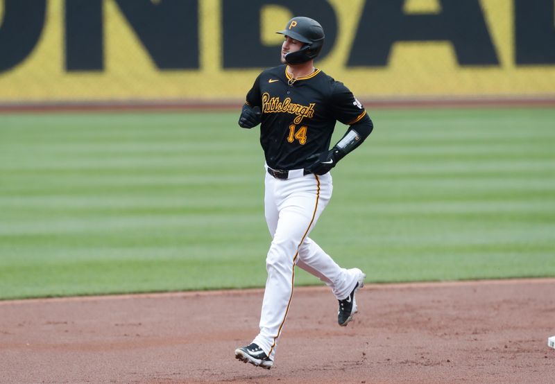 Apr 25, 2024; Pittsburgh, Pennsylvania, USA;  Pittsburgh Pirates catcher Joey Bart (14) circles the bases on a three run home run against the Milwaukee Brewers during the first inning at PNC Park. Mandatory Credit: Charles LeClaire-USA TODAY Sports