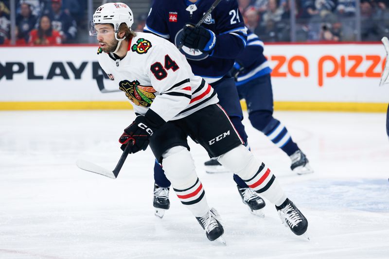 Mar 3, 2026; Winnipeg, Manitoba, CAN;  Chicago Blackhawks forward Landon Slaggert (84) skates after the puck in the Winnipeg Jets zone during the first period at Canada Life Centre. Mandatory Credit: Terrence Lee-Imagn Images