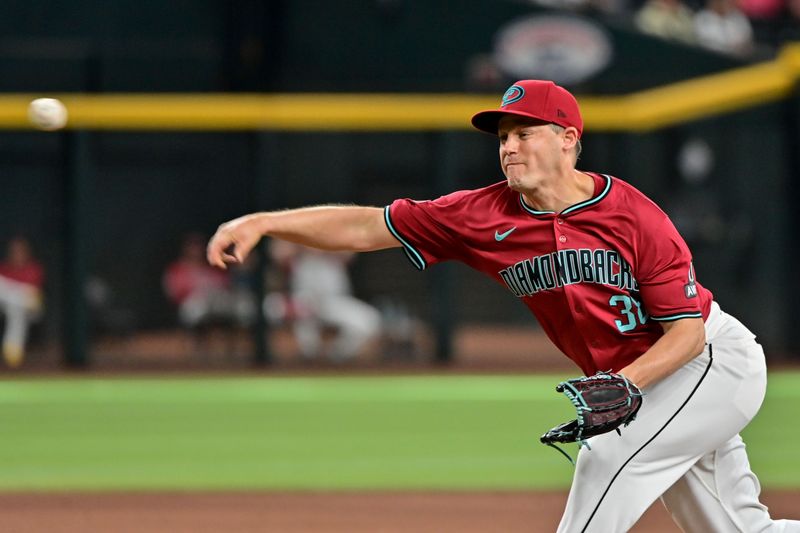 May 15, 2024; Phoenix, Arizona, USA;  Arizona Diamondbacks pitcher Paul Sewald (38) throws in the ninth inning against the Cincinnati Reds at Chase Field. Mandatory Credit: Matt Kartozian-USA TODAY Sports