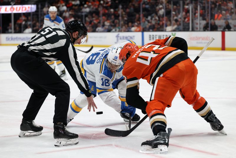 Mar 8, 2026; Anaheim, California, USA;  St. Louis Blues center Robert Thomas (18) and Anaheim Ducks center Tim Washe (42) faceoff during the third period at Honda Center. Mandatory Credit: Kiyoshi Mio-Imagn Images
