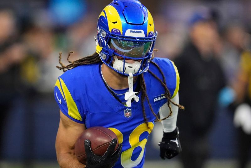 Los Angeles Rams wide receiver Jordan Whittington warms jp prior to an NFL football game against the Miami Dolphins, Monday, Nov. 11, 2024, in Inglewood, Calif. (AP Photo/Marcio Jose Sanchez)