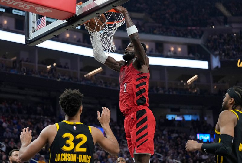 SAN FRANCISCO, CALIFORNIA - DECEMBER 23: Deandre Ayton #2 of the Portland Trail Blazers slam dunks in the first half against the Golden State Warriors at Chase Center on December 23, 2023 in San Francisco, California. NOTE TO USER: User expressly acknowledges and agrees that, by downloading and or using this photograph, User is consenting to the terms and conditions of the Getty Images License Agreement. (Photo by Thearon W. Henderson/Getty Images)