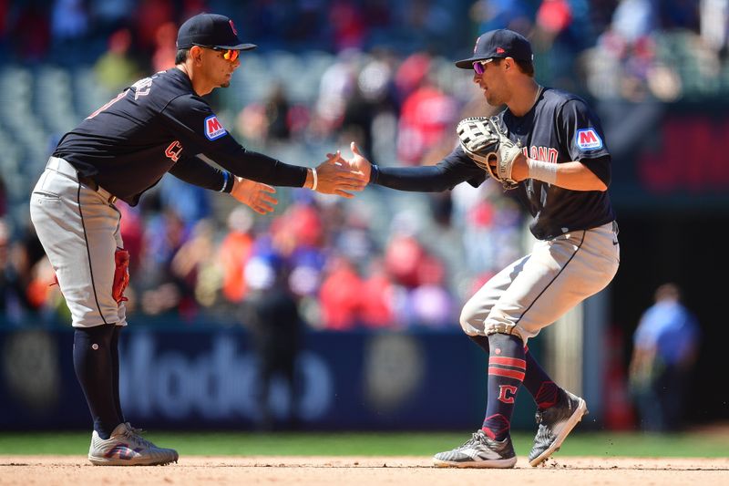 May 26, 2024; Anaheim, California, USA; Cleveland Guardians second base Andres Gimenez (0) and outfielder Tyler Freeman (2) celebrate the victory against the Los Angeles Angels at Angel Stadium. Mandatory Credit: Gary A. Vasquez-USA TODAY Sports