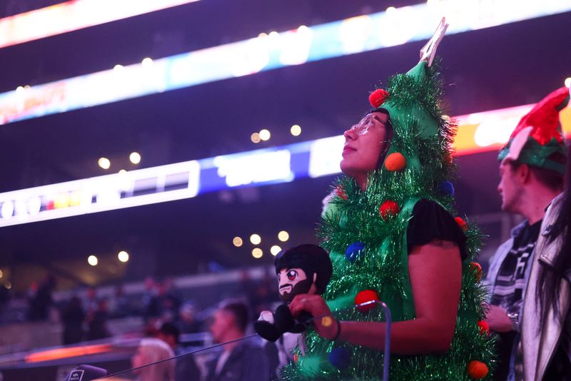 Dec 23, 2023; Los Angeles, California, USA; A Los Angeles Kings fan looks on before a game against the Calgary Flames at Crypto.com Arena. Mandatory Credit: Jessica Alcheh-USA TODAY Sports