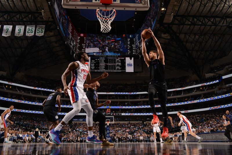 DALLAS, TX - APRIL 12: Dwight Powell #7 of the Dallas Mavericks grabs the rebound during the game against the Detroit Pistons on April 12, 2024 at the American Airlines Center in Dallas, Texas. NOTE TO USER: User expressly acknowledges and agrees that, by downloading and or using this photograph, User is consenting to the terms and conditions of the Getty Images License Agreement. Mandatory Copyright Notice: Copyright 2024 NBAE (Photo by Glenn James/NBAE via Getty Images)