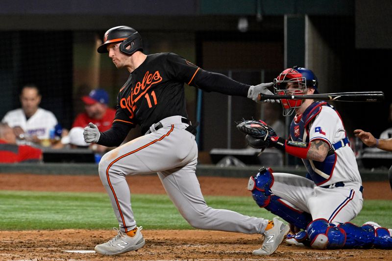 Oct 10, 2023; Arlington, Texas, USA; Baltimore Orioles second baseman Jordan Westburg (11) hits a single against the Texas Rangers in the fifth inning during game three of the ALDS for the 2023 MLB playoffs at Globe Life Field. Mandatory Credit: Jerome Miron-USA TODAY Sports