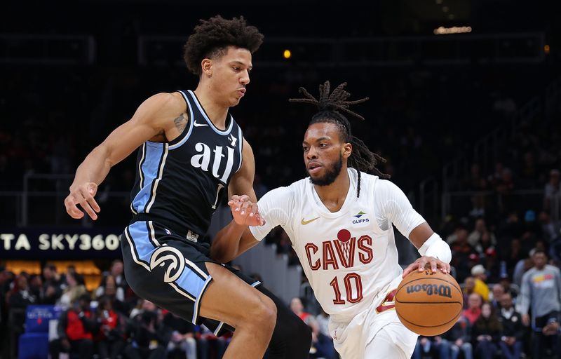 ATLANTA, GEORGIA - MARCH 06:  Darius Garland #10 of the Cleveland Cavaliers drives against Jalen Johnson #1 of the Atlanta Hawks during the first quarter at State Farm Arena on March 06, 2024 in Atlanta, Georgia.  NOTE TO USER: User expressly acknowledges and agrees that, by downloading and/or using this photograph, user is consenting to the terms and conditions of the Getty Images License Agreement.  (Photo by Kevin C. Cox/Getty Images)