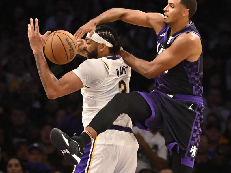 LOS ANGELES, CALIFORNIA - OCTOBER 26: Anthony Davis #3 of the Los Angeles Lakers is fouled by Keegan Murray #13 of the Sacramento Kings in the second half at Crypto.com Arena on October 26, 2024 in Los Angeles, California. NOTE TO USER: User expressly acknowledges and agrees that, by downloading and or using this photograph, User is consenting to the terms and conditions of the Getty Images License Agreement. (Photo by John McCoy/Getty Images)