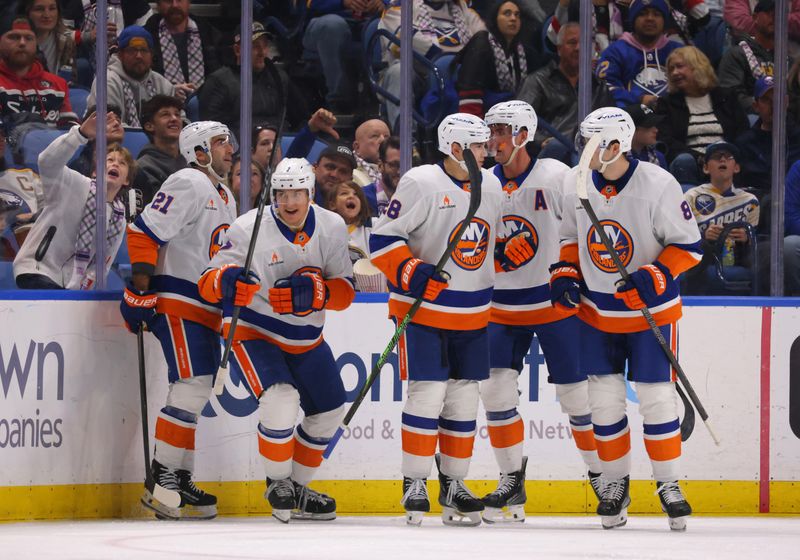 Nov 1, 2024; Buffalo, New York, USA;  New York Islanders right wing Maxim Tsyplakov (7) celebrates his goal with teammates during the second period against the Buffalo Sabres at KeyBank Center. Mandatory Credit: Timothy T. Ludwig-Imagn Images